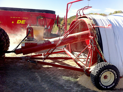 Bagging ground corn with feed mixer